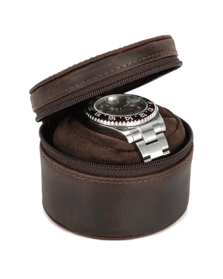 Open brown round watch storage case with soft interior and zipper closure